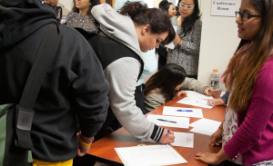 A variety of Skyline students register at MK Asante’s lecture Tuesday afternoon.