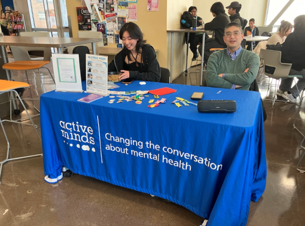 Active Minds sets up table for De-Stress Week in Building 6.