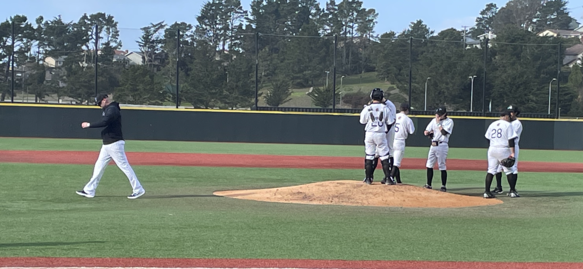 Coach Bruincardi visiting the mound after a few mishaps in the top of the 4th.